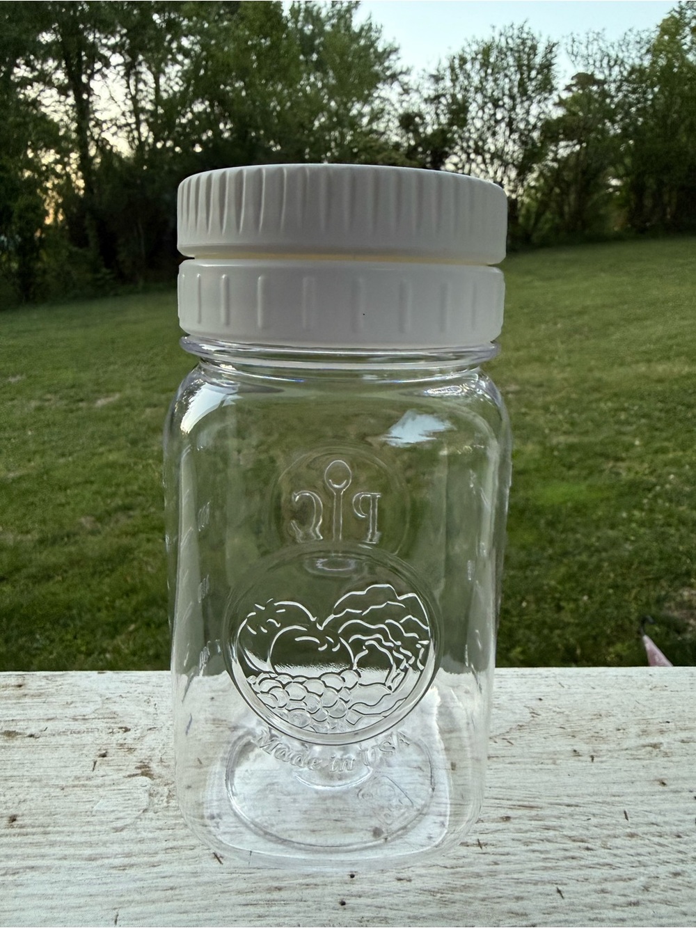 The Pampered Chef Clear Pantry Jar with White Lid and separate compartment